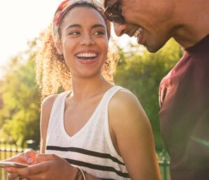 happy-couple-sharing-lifeline-acp-phone